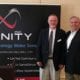 Chuck Brown and Bill Hubbard smile as Infinity sponsors Chamber New Member Orientation