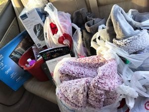 employees donate gifts to Union Mission Secret Santa