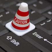 warning cone on keyboard to show caution and liability