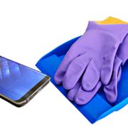 digital spring cleaning with cell phone, dustpan, and wash gloves