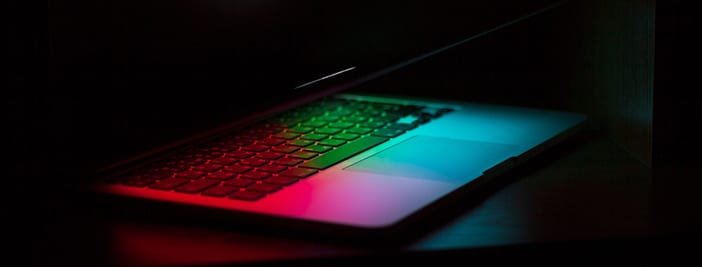 laptop glowing in the dark with hidden microsoft tools