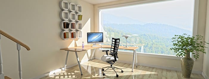 sunlight shining in home office with happy employee working remotely