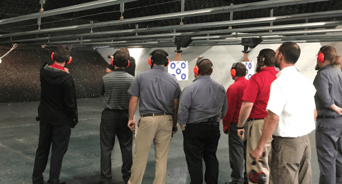 Infinity employees at target shooting range
